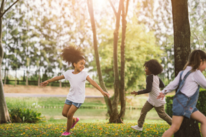 Cute african american little girl playing outdoor - Black people kid and friend happy.