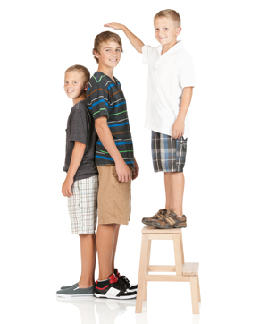 Smal boy standing on stool and comparing heighthttp://www.twodozendesign.info/i/1.png