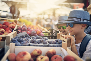 Kids buying at the street market in Verona, Italy. Brothers are browsing fresh organic fruit.
Nikon D850