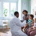 Close up of a young family at a Pediatrician's Office