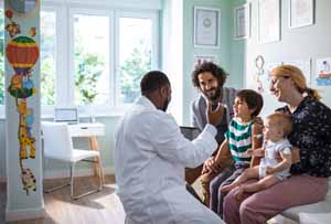 Close up of a young family at a Pediatrician's Office