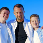 A father and his sons with blue sky as a background.Additional images of these models found here:  http://www.istockphoto.com/file_search.phpaction=file&amp;lightboxID=2781799