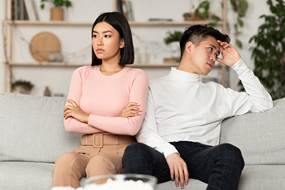 Asian Couple After Quarrel Sitting Offended Not Talking To Each Other Having Relationship Problems At Home. Spouses After Family Conflict, Breakup, Relationship Crisis Concept