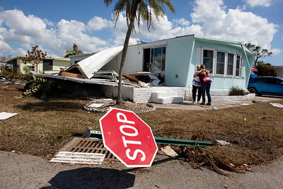 A resident of a mobile home park is comforted by a member of the American Red Cross South Florida Region. 
Photo by Marko Kokic/American Red Cross/Flickr