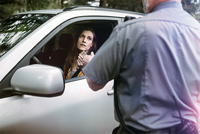 woman police car traffic stop speeding