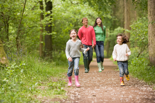 123904373 Family walking on path smiling